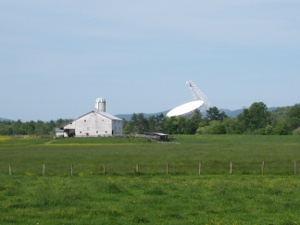 Green Bank Radio Telescope in background of farm